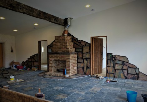 Main living area with unsealed slate tiles