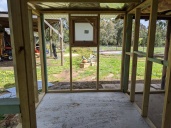 Toilet and laundry area with window and roof
